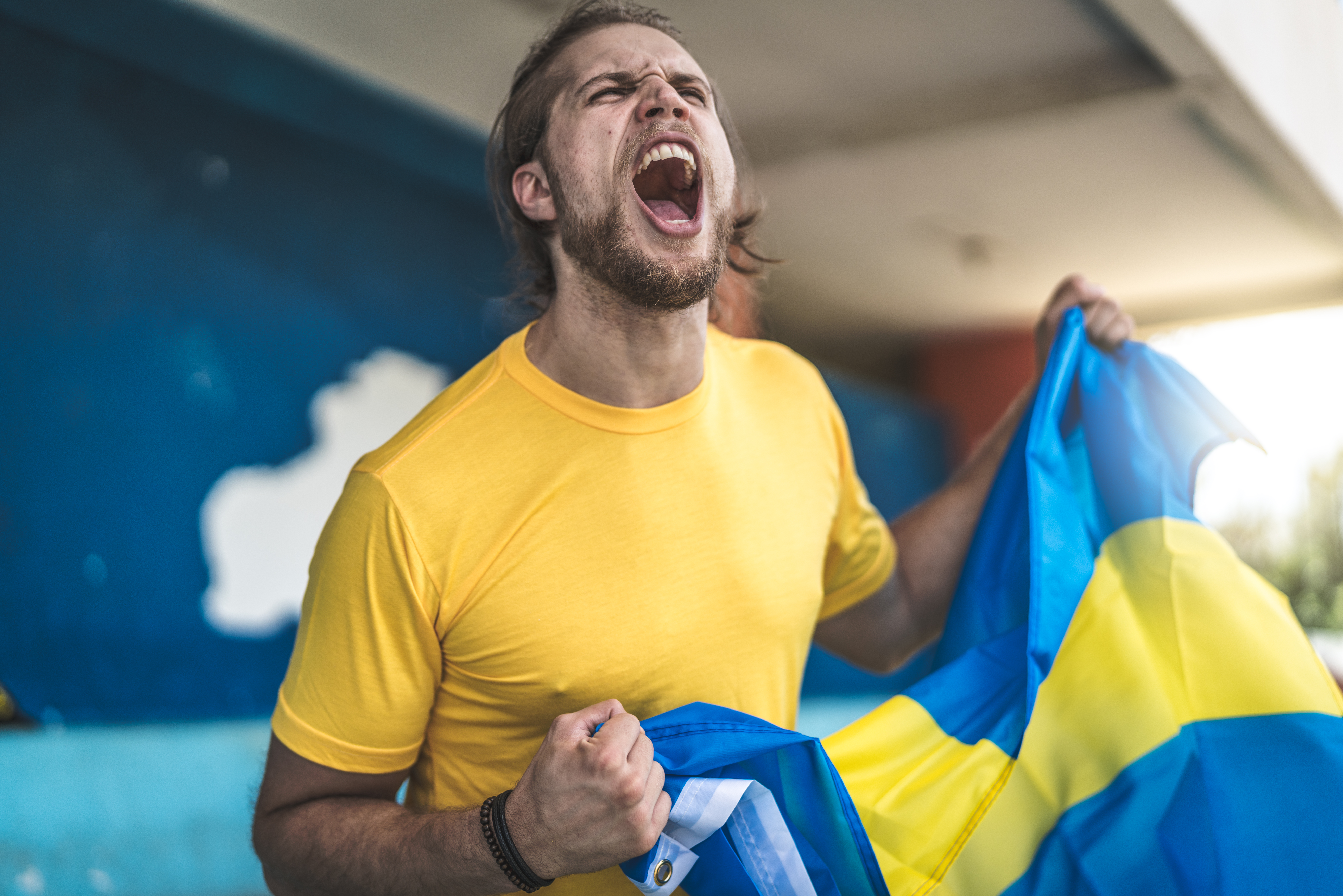 Swedish fan watching a soccer game
